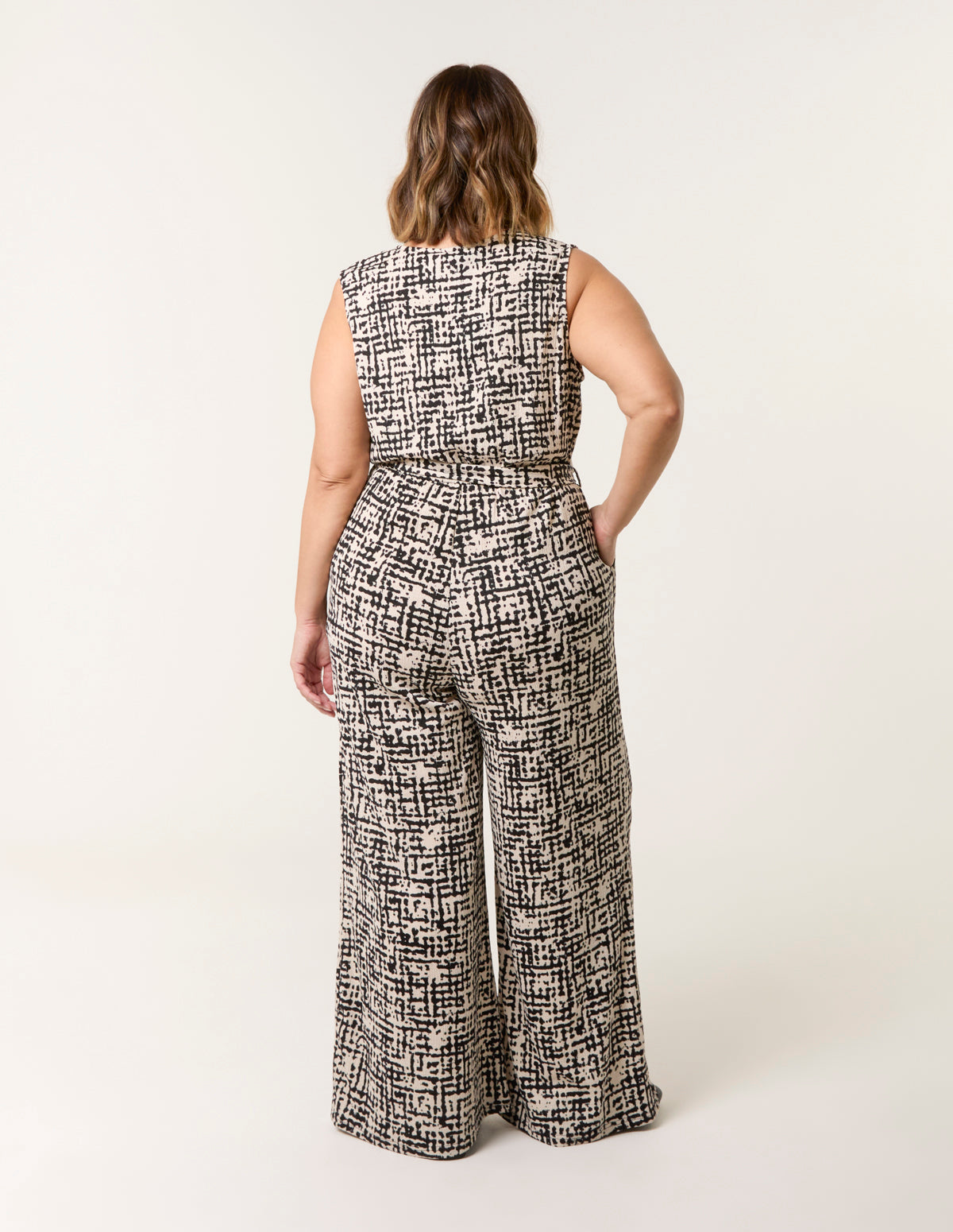 Curve Sleeveless Belted Jumpsuit