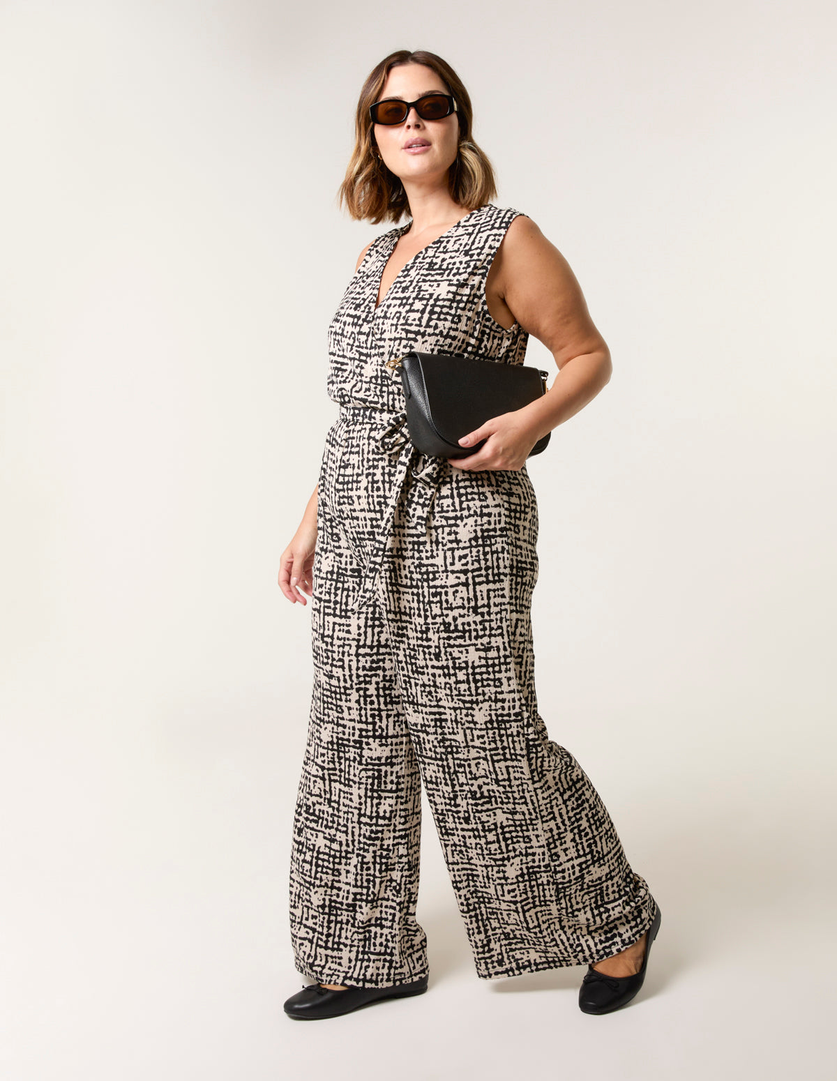 Curve Sleeveless Belted Jumpsuit