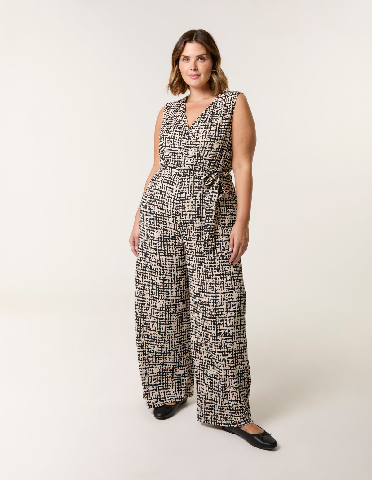Curve Sleeveless Belted Jumpsuit